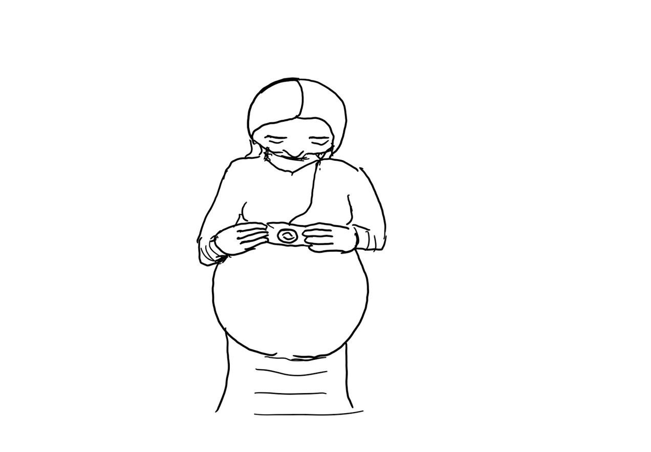 Pregnant woman holds a camera